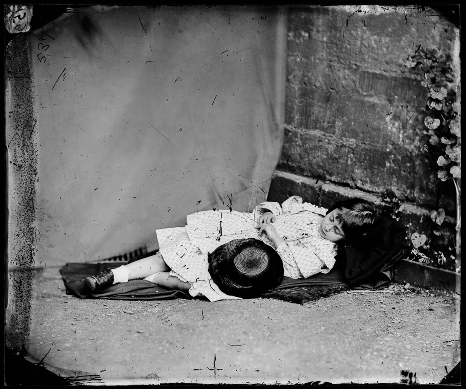 Lewis Carroll (photograph) — Alice in feigned sleep, 1860